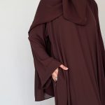 Brown everyday abaya with pockets, made from breathable fabric for comfortable daily wear.