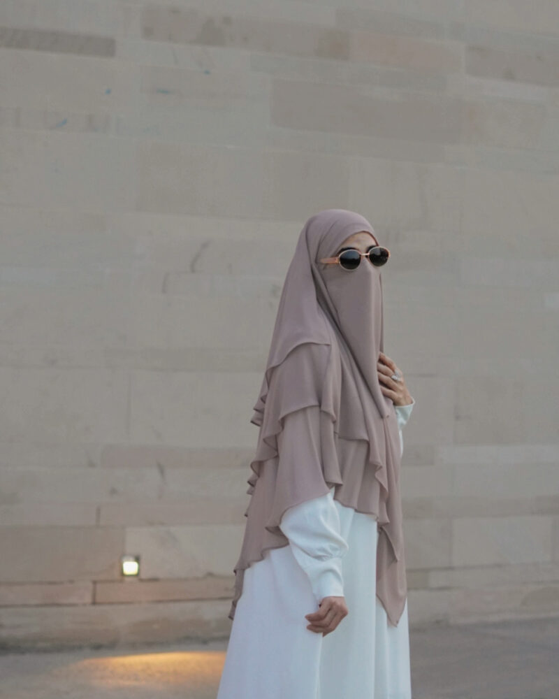 3-layer chiffon khimar in lightweight fabric, offering full coverage with elegant layered design.
